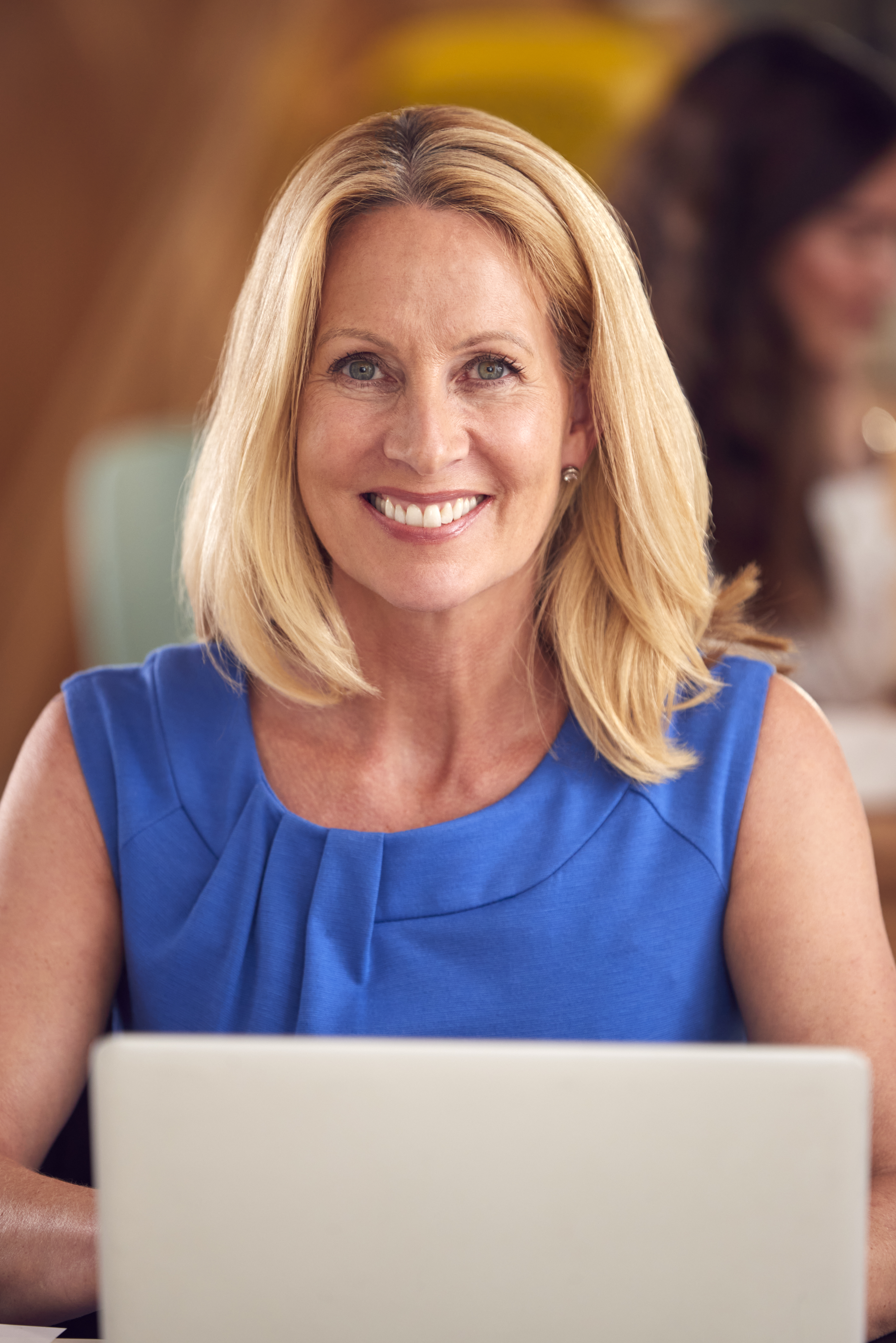 portrait-mature-businesswoman-with-laptop-working-table-office-coffee-shop.jpg