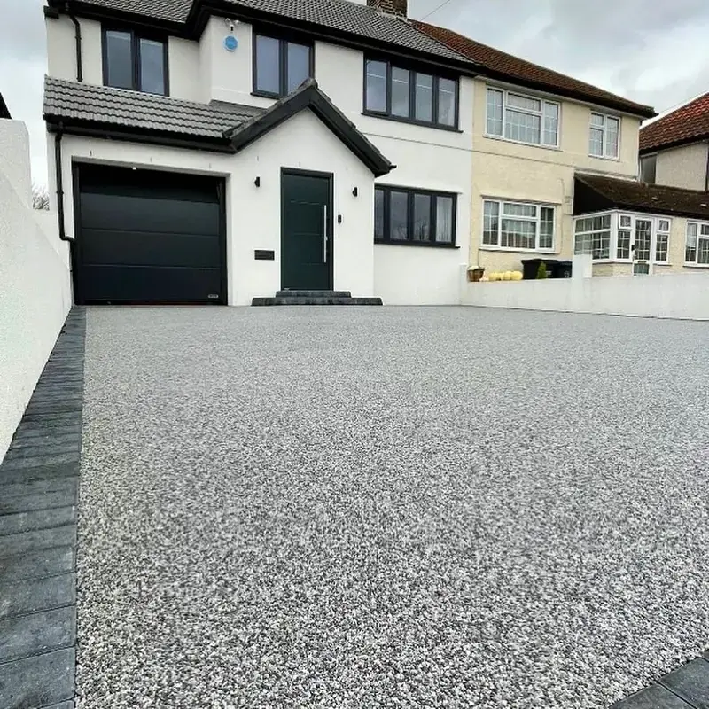 Eye-level view of a smooth resin driveway in Timperley