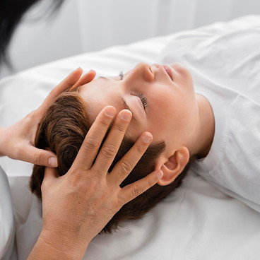 female-osteopathist-treating-boy-hospital.jpg