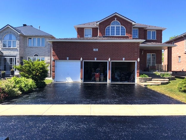 Clean driveway sealing job performed by Ark Services Group professionals