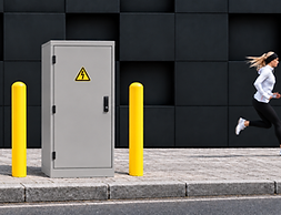 Yellow bollards flank roadside electrical cabinet.png