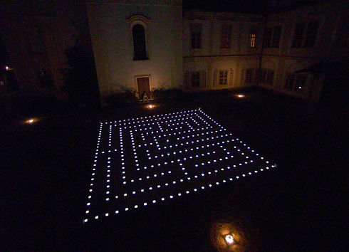 The Loucen "Light Maze" at night, lit up by the lights that form the mazes borders and paths.