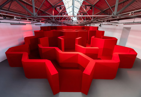 Striking red maze for the designer Anya Hindmarch's London Fashion Week 2019 show.