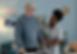 positive-black-female-caregiver-helping-senior-man-walking-with-frame-indoors.png
