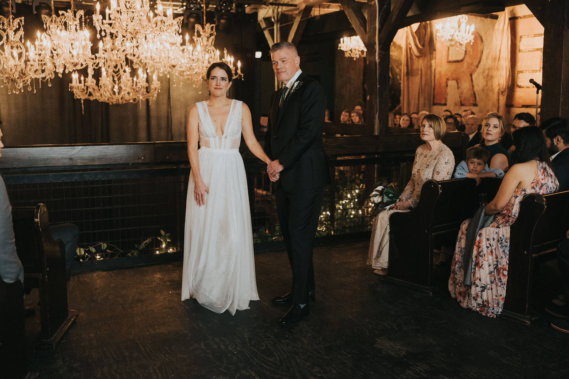 bride and groom look on as the musicians play during their wedding ceremony