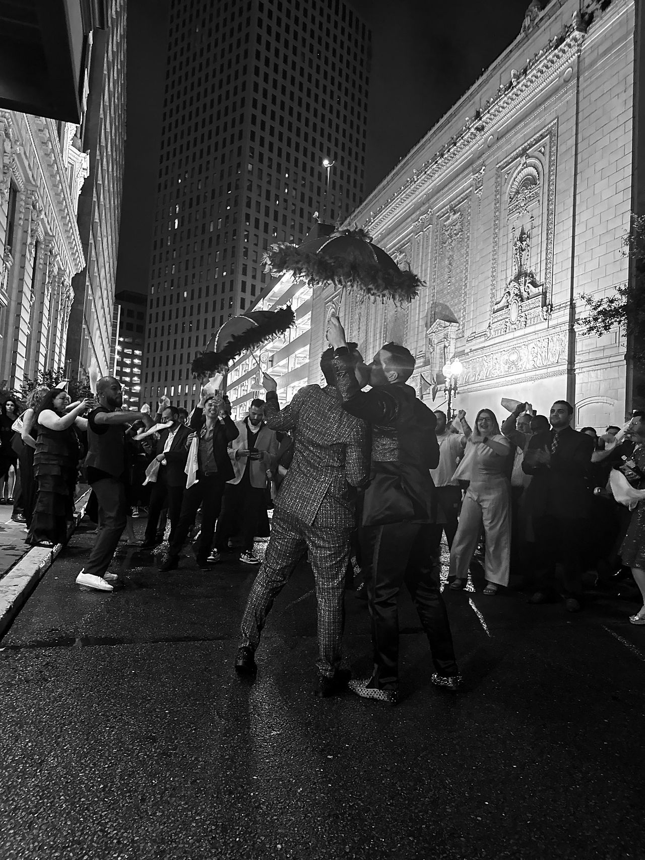 Groom and Groom kiss at the end of their Second Line parade. Photo courtesy of Josh Williams Photo