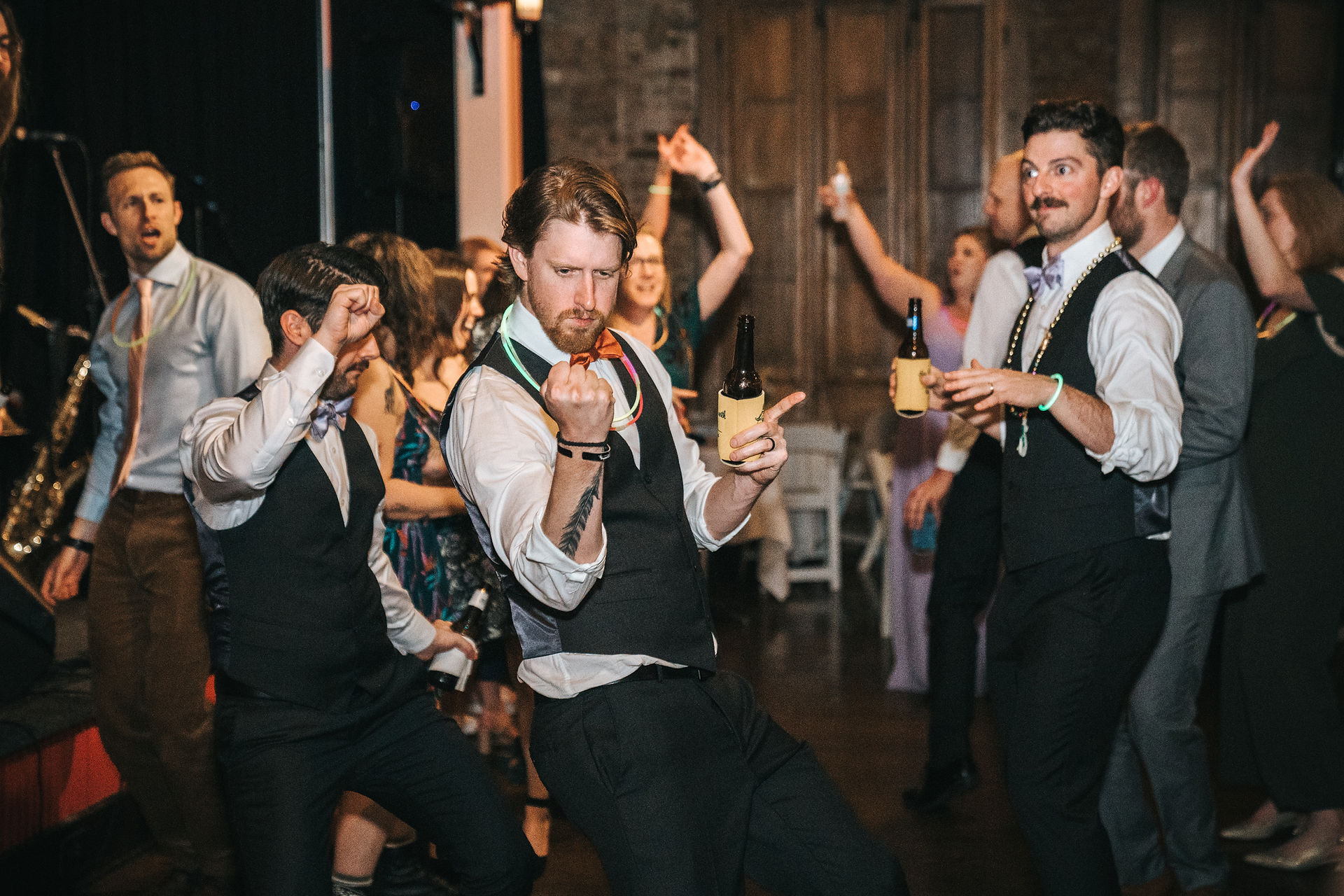guests dance with glow sticks