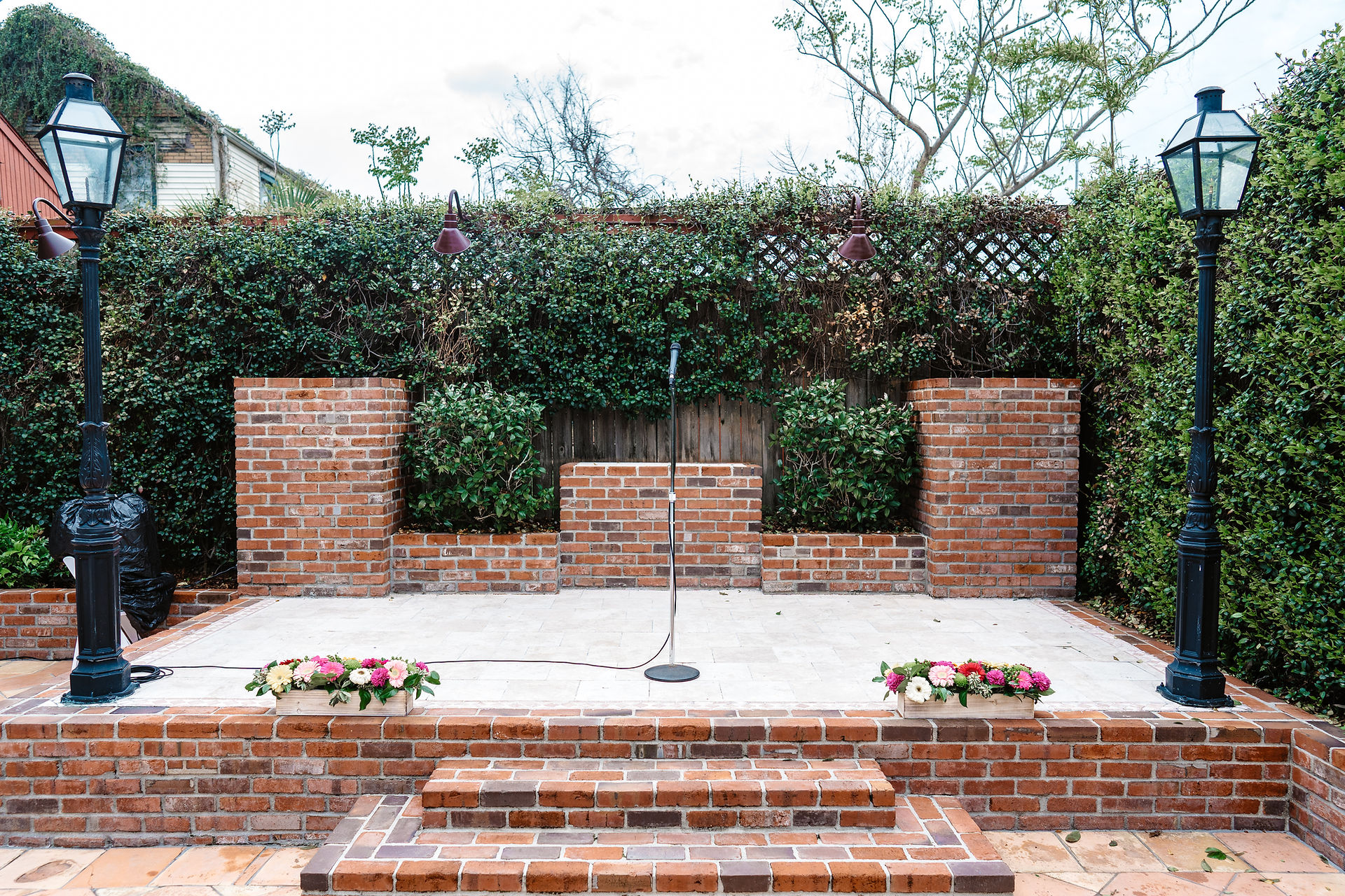 wedding ceremony stage in garden courtyard