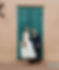 Bride and Groom pose in front of the Green wooden door at Arnaud's Restaurant in New Orleans