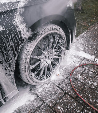 Car wheels get complete wash and dressing during our wash & wax service offered across Orange County