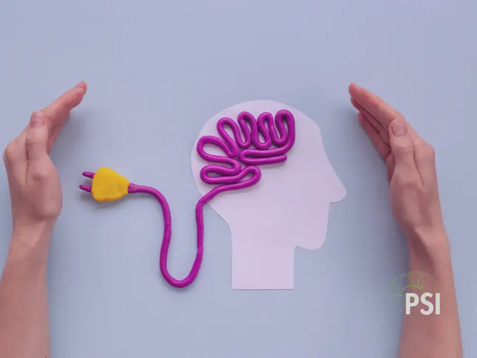 Dos manos que están guardando una ilustración de un cerebro
