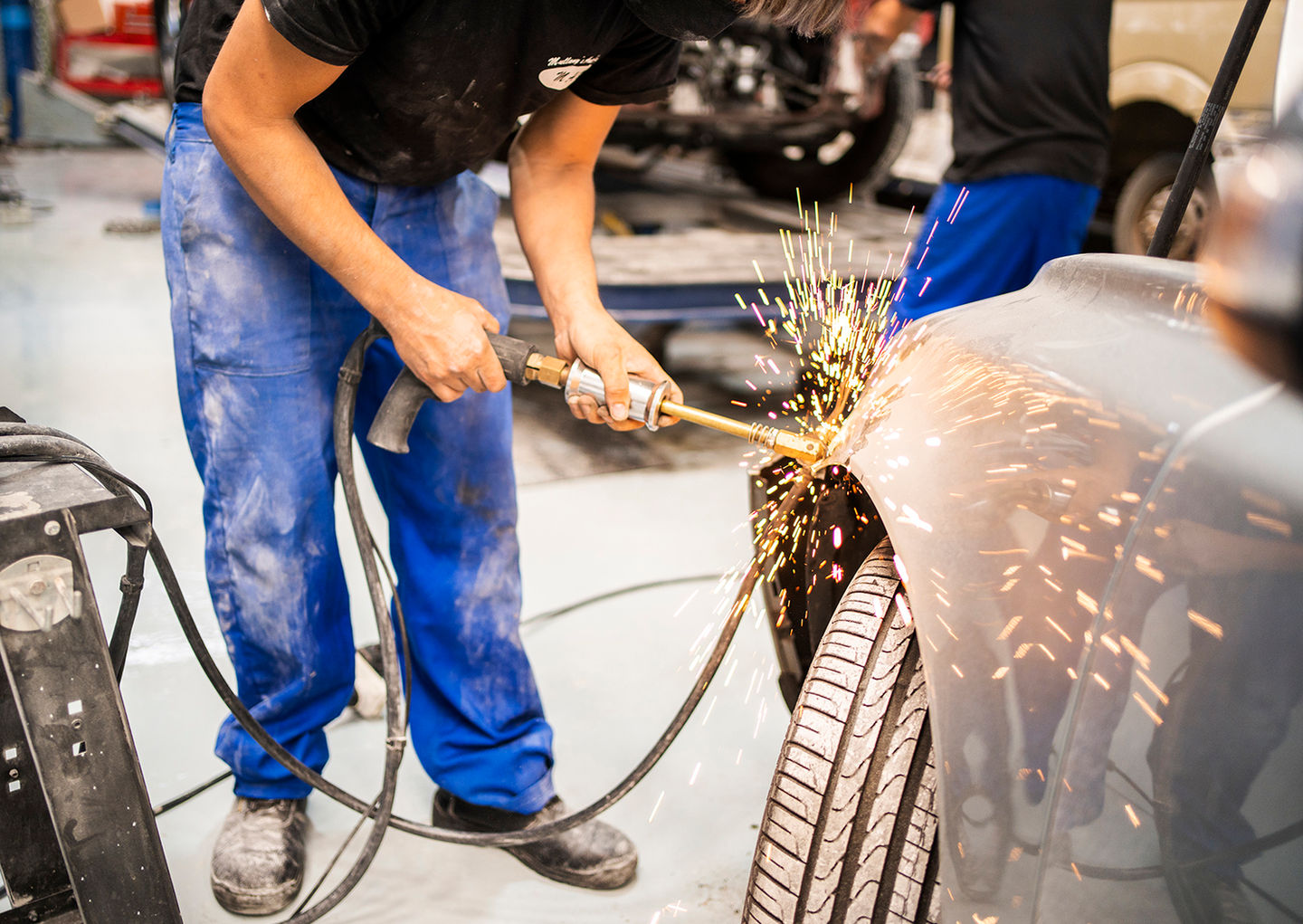 Nicky Lloyd Photography in South Africa & Southern Africa - a man is fixing a car