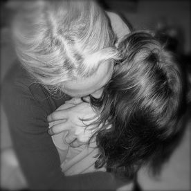 Sandee embracing Storey tightly, black and white photo