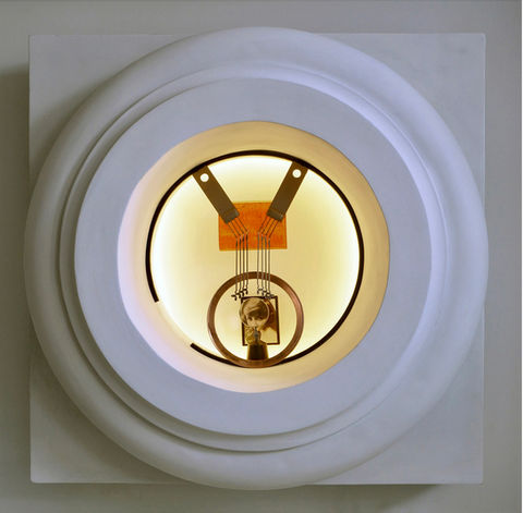 Illuminated sculpture titled Berthe Bady by Sanford Kogan featuring a vintage photographic portrait integrated within an architectural framework of repurposed materials