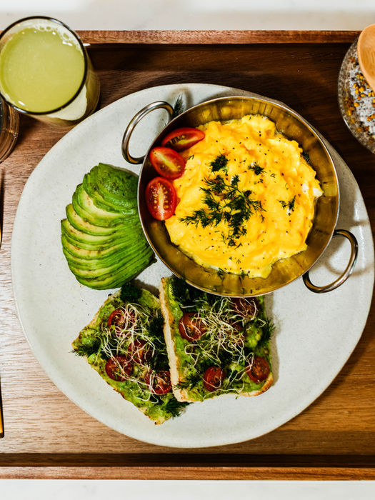 Cuisine Dish of Cooked of scrambled eggs with avocado toast