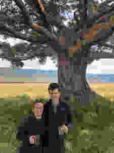 Stan and Leah in front of a tree