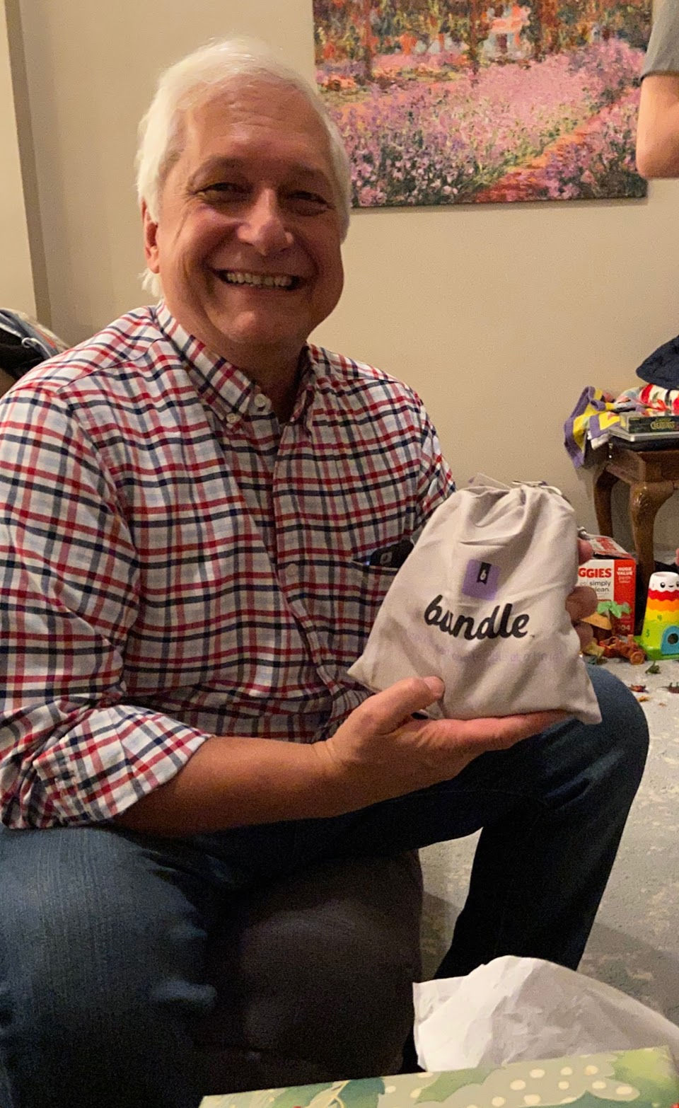 Dad Bort excitedly holdiing the personalized Family Bundle with a huge smile on his face.