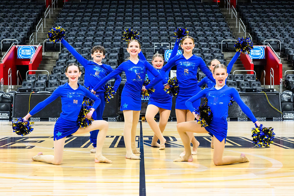 Dance troupe in blue holding pom pose