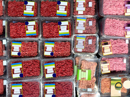 Ground Beef at supermarket refrigerator. View from above. Brand-less packaging mockup and illustration ideal for graphic designers, architects and interior designers.