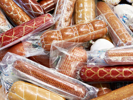Pile of sausages in plastic vacuum packs