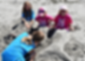 4 camper girls in the sand