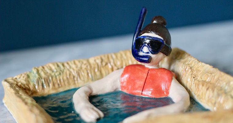 ceramic art snorkler swimmer in a cave