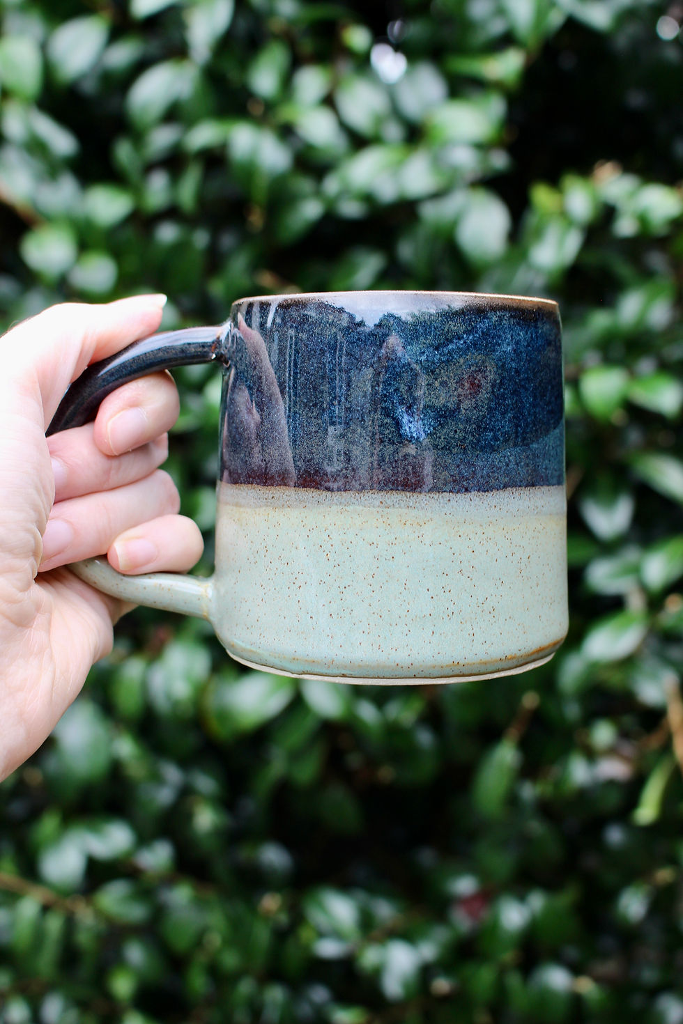 Thumbnail: Hand thrown stoneware ceramic mug dark inky blue with light stone blue glaze
