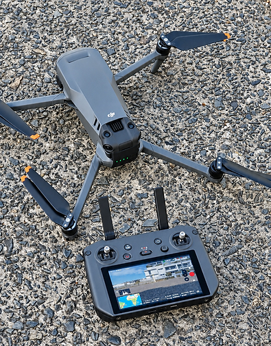 DJI Drone and Controller on Asphalt.png
