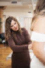 bridal consultant helping bride