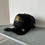Miniatura: Negra tipo trucker con logo dorado, Ravens NFL patch