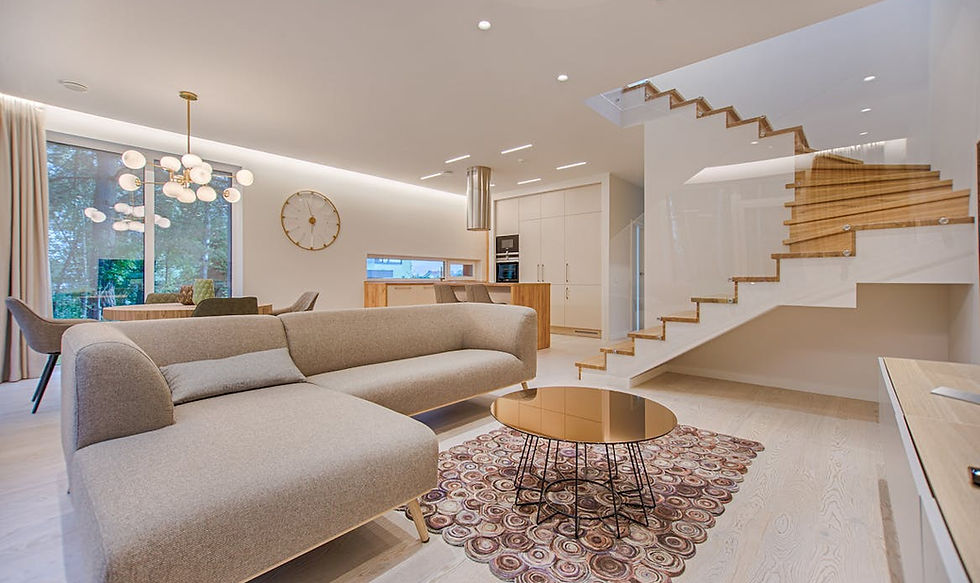 Professional HDR interior photography of a modern Vancouver living room showcasing balanced lighting and mountain views through large windows