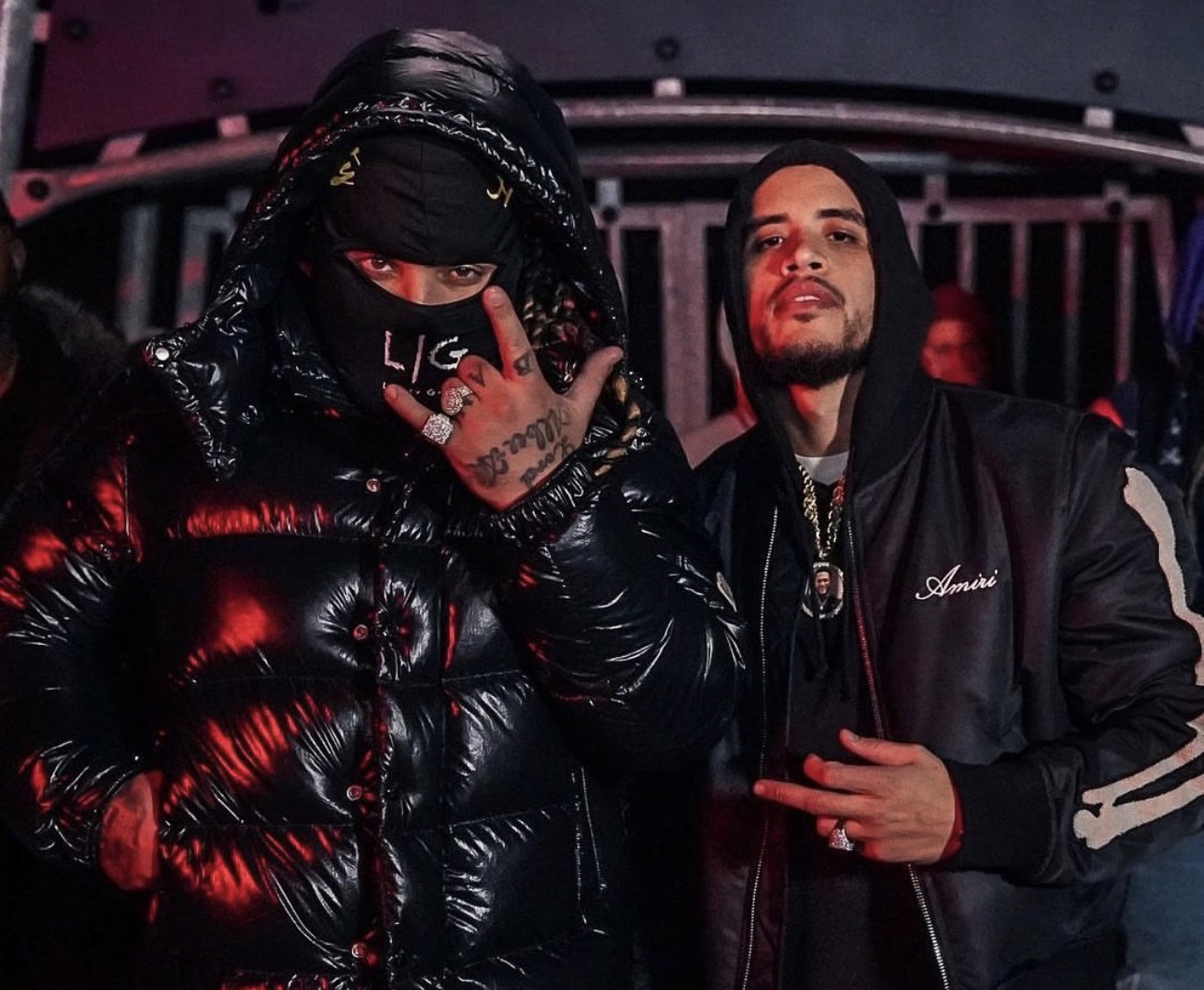 Two people posing during a music video shoot