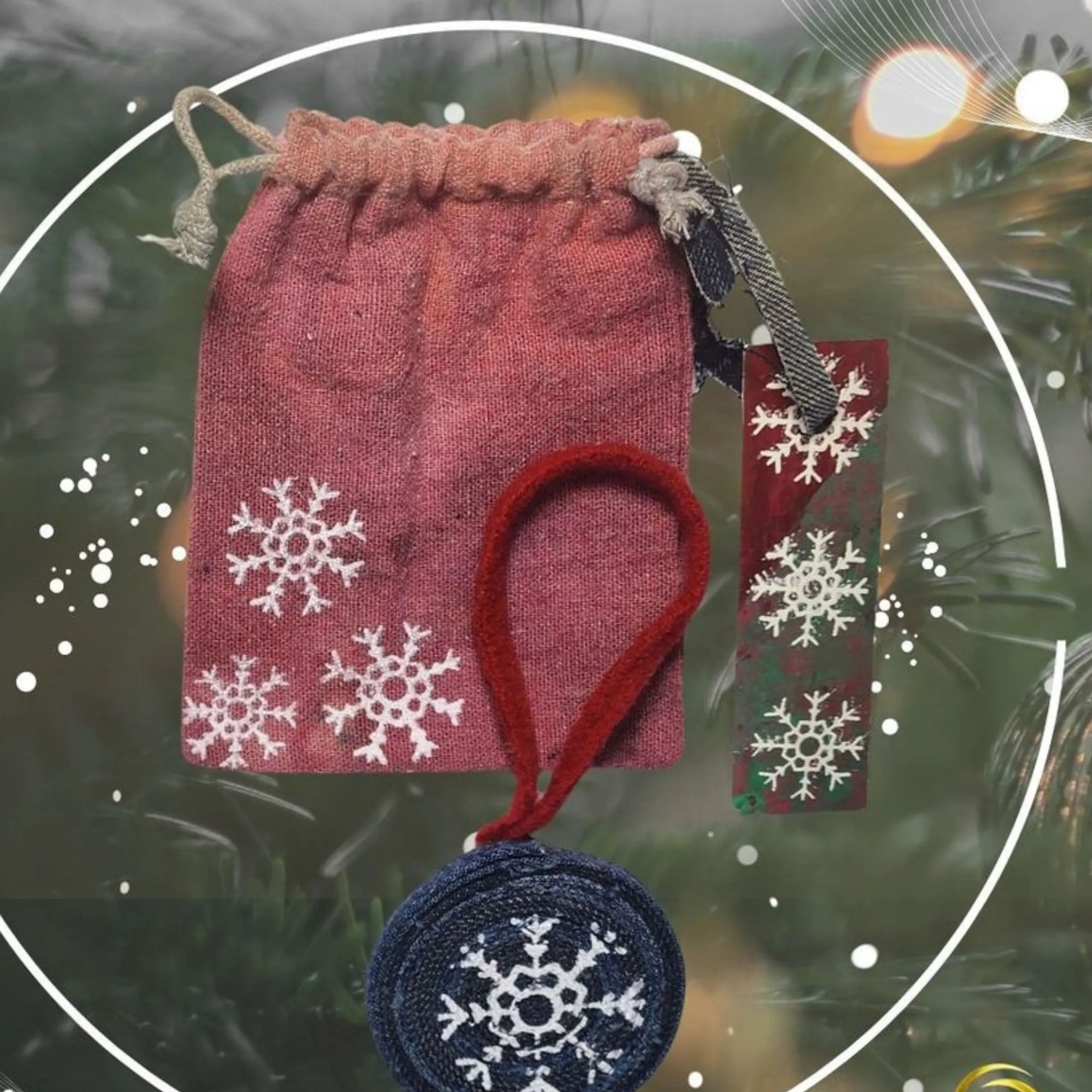 Front view of the Upcycled Denim Ornament, highlighting the screen-printed Snowflake design. (Condition: Handmade/Eco-Friendl