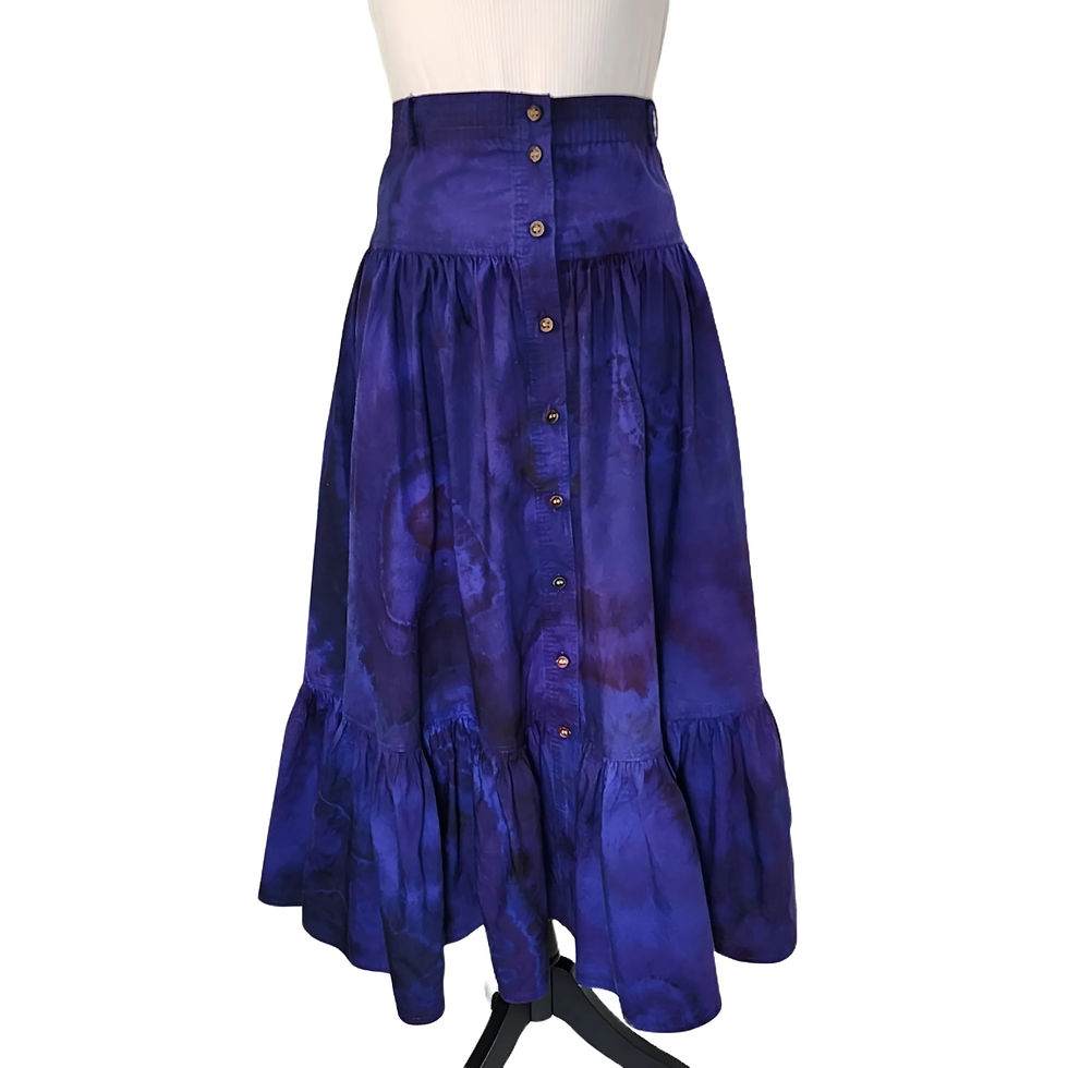 Thumbnail: Front view of the Vintage Tiered Skirt, showcasing the wood button-down front and the purple/blue tie-dye geode patterns.