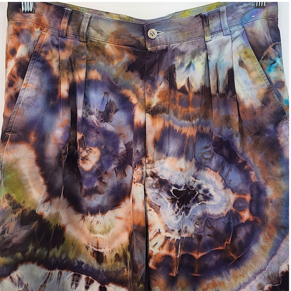 Thumbnail: Front view of reworked vintage Claiborne pants featuring a purple and green geode hand-dyed pattern and classic pleats at the