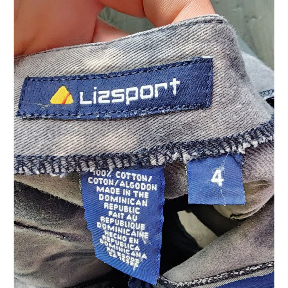 Close-up of the tags, confirming Good Vintage condition and 100% Cotton material.