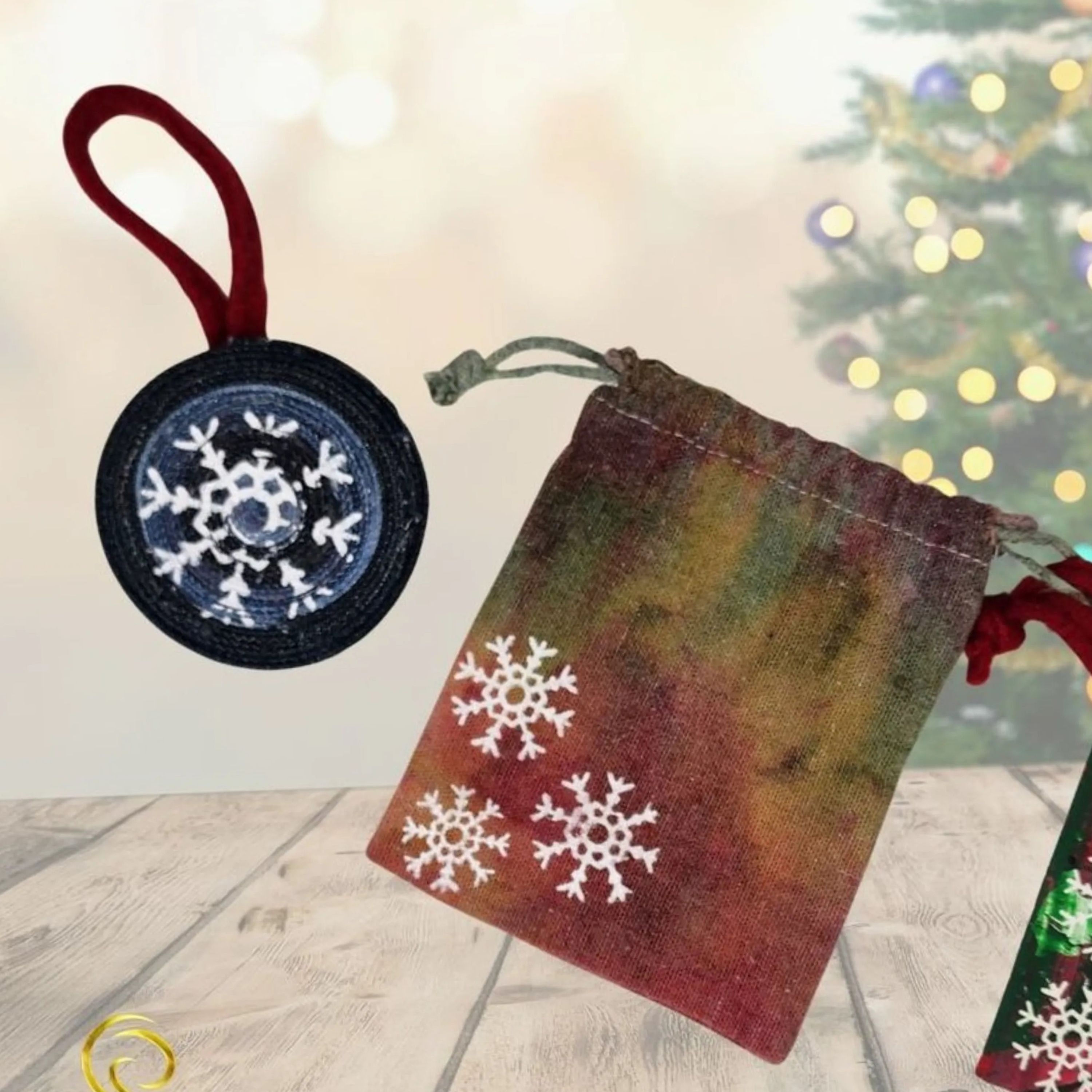 Front view of the Upcycled Denim Ornament, highlighting the screen-printed Snowflake design. (Condition: Handmade/Eco-Friendl