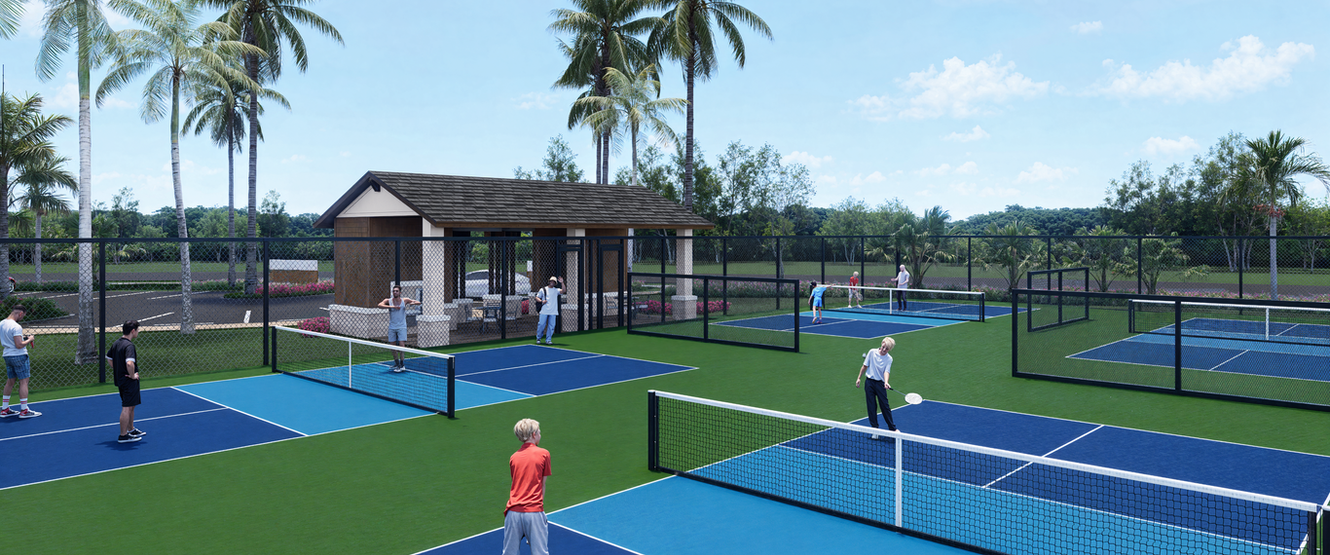 Fenced pickleball courts with blue playing surfaces and adjacent pavilion within a landscaped Florida community setting