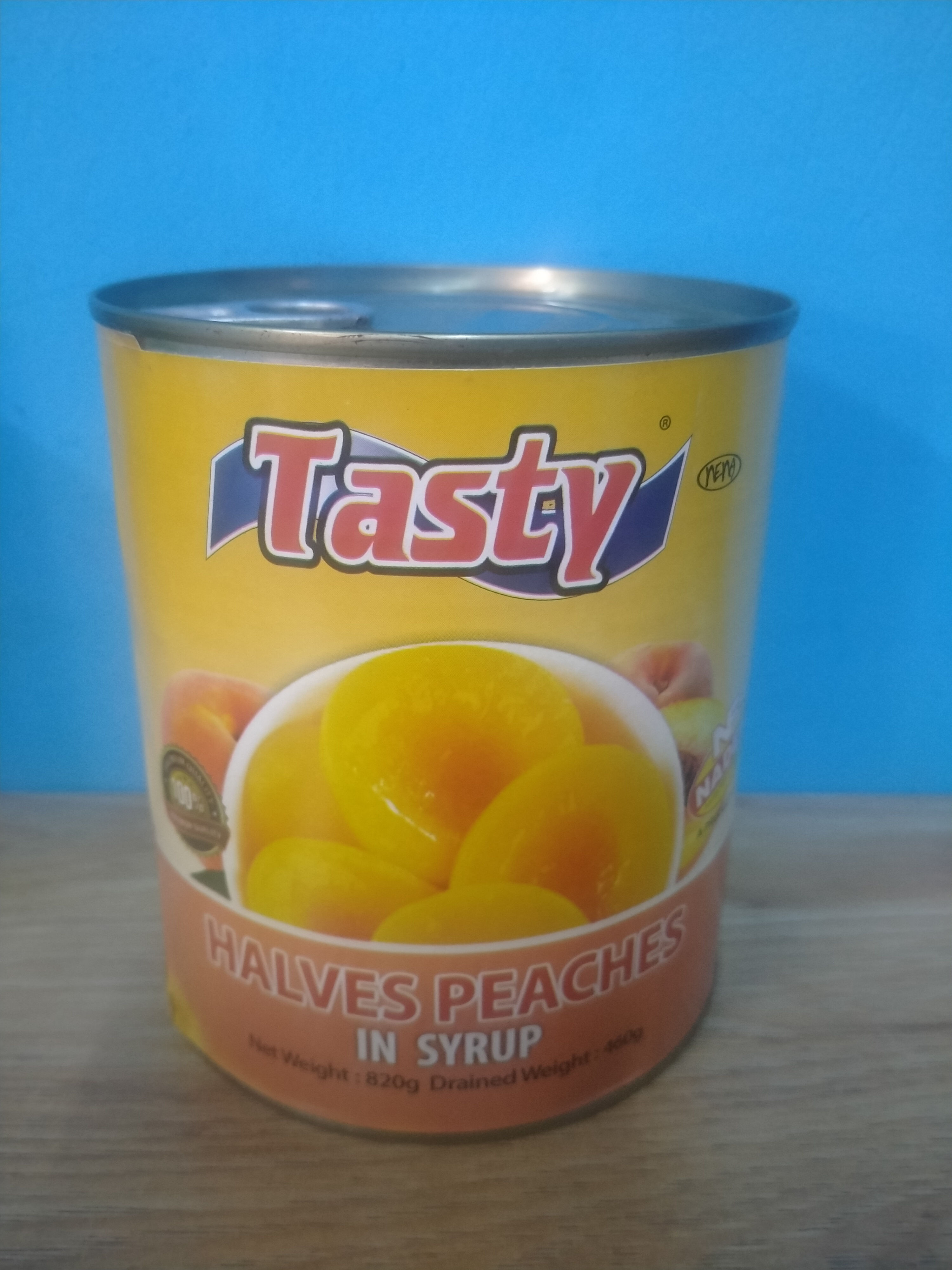 Tasty halves peaches in syrup