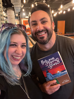 Readers holding Between the Waves and the Stars during the book’s Staten Island launch celebration.