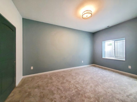 Bedroom 3. Carpet, craftsman doors, craftsman trim, statement light fixtures.