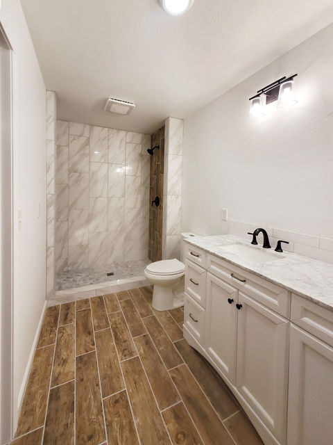Oxford Master Bathroom. Rain shower head, tile floors, marble shower, WiFi fan/ light combo, custom storage niche in the shower.