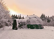 Nature Domes in the Snow at Top of the Woods. A nature-based holiday retreat offering luxury glamping and eco camping in Pembrokeshire, Wales. One of the best dog-friendly sites for slow travel and wild escapes in the UK.