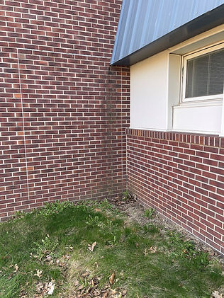 An image of a brick wall that has been tuckpointed, with the new mortar perfectly matched to the existing mortar. The repair is seamless, restoring the wall’s clean and uniform appearance.
