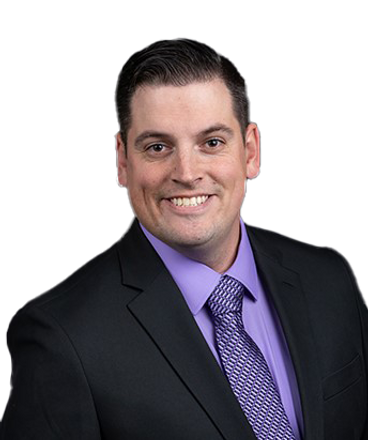 Tanner Yackley in a suit with a purple shirt and tie