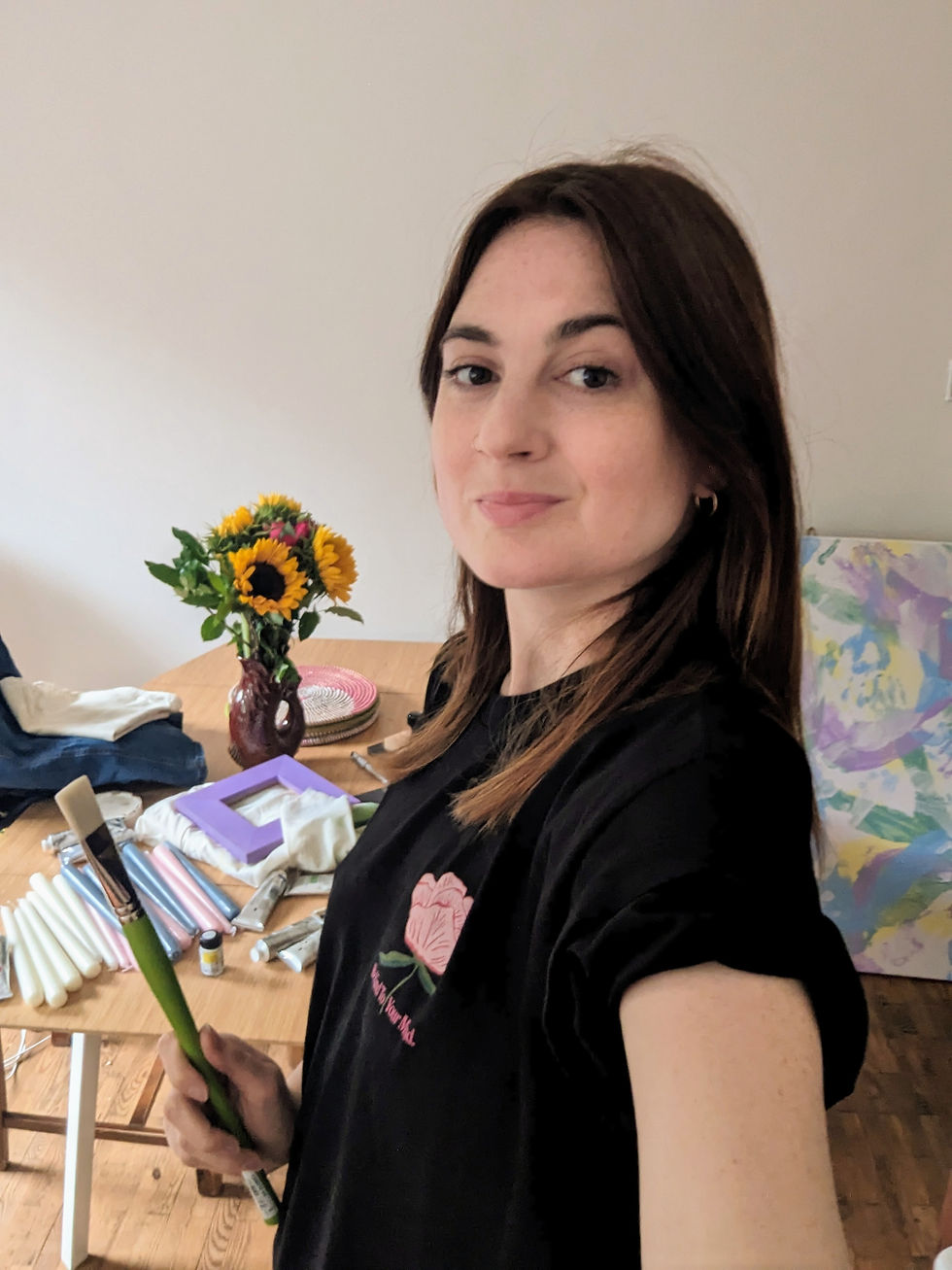 Artist, Miranda Charlotte, posing at her London-based studio in 2023