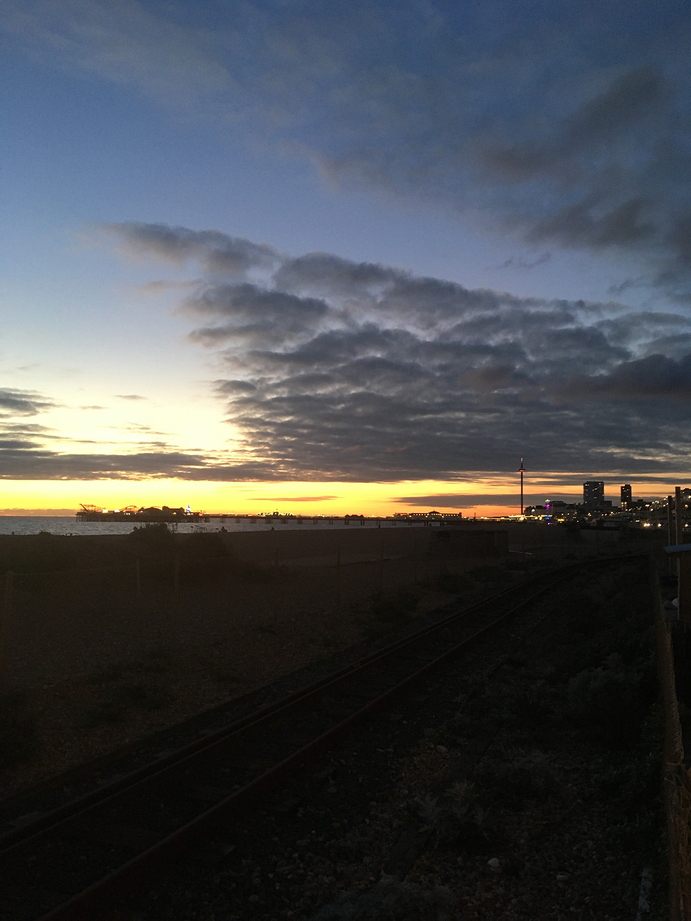 A Brighton sunset overlooking Brighton Pier and the British Airways i360