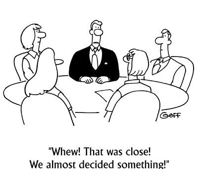 A group of men and women discussing business as a part of review meeting