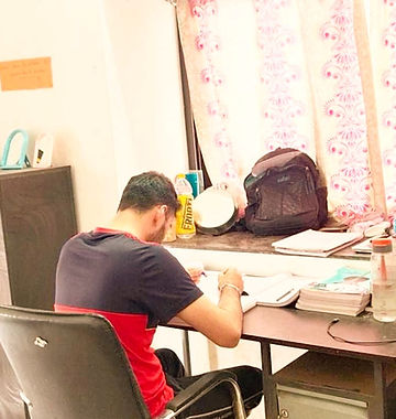 A person studying on a table