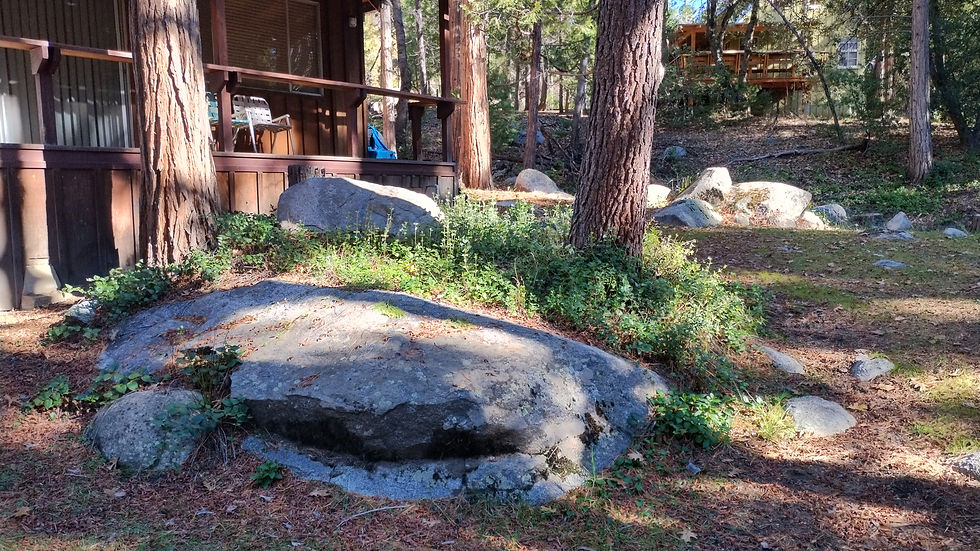 Boulders in front of cabin